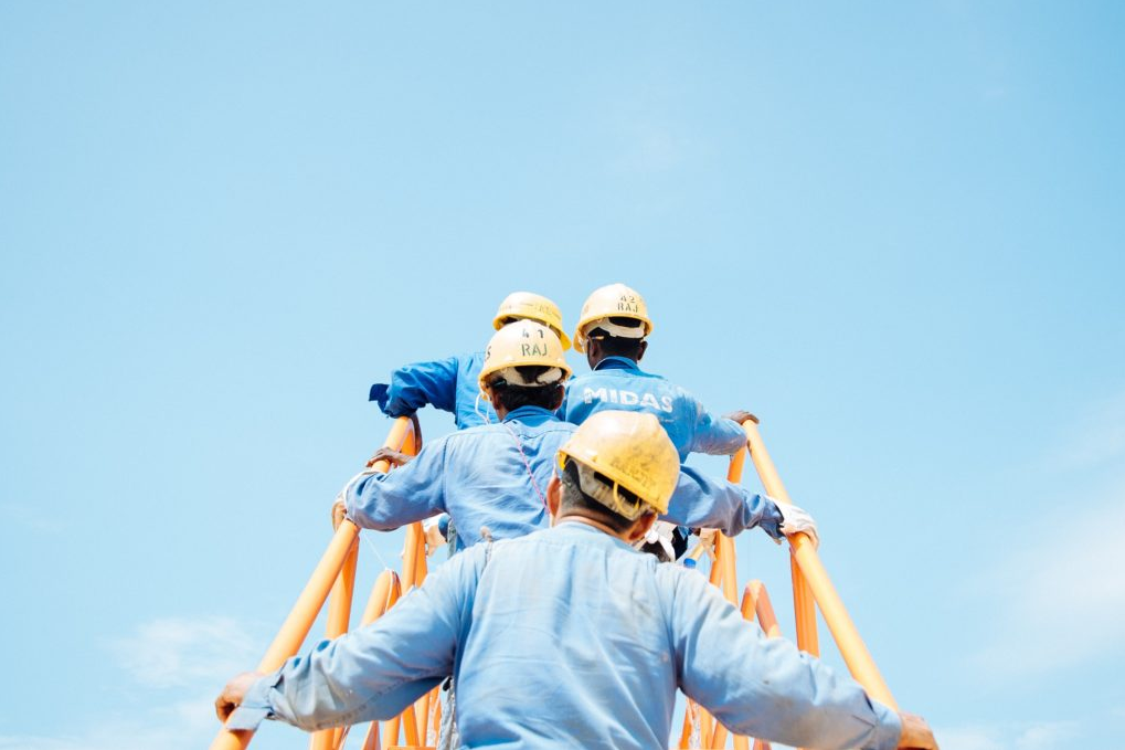 Employees walking up stairs to their business